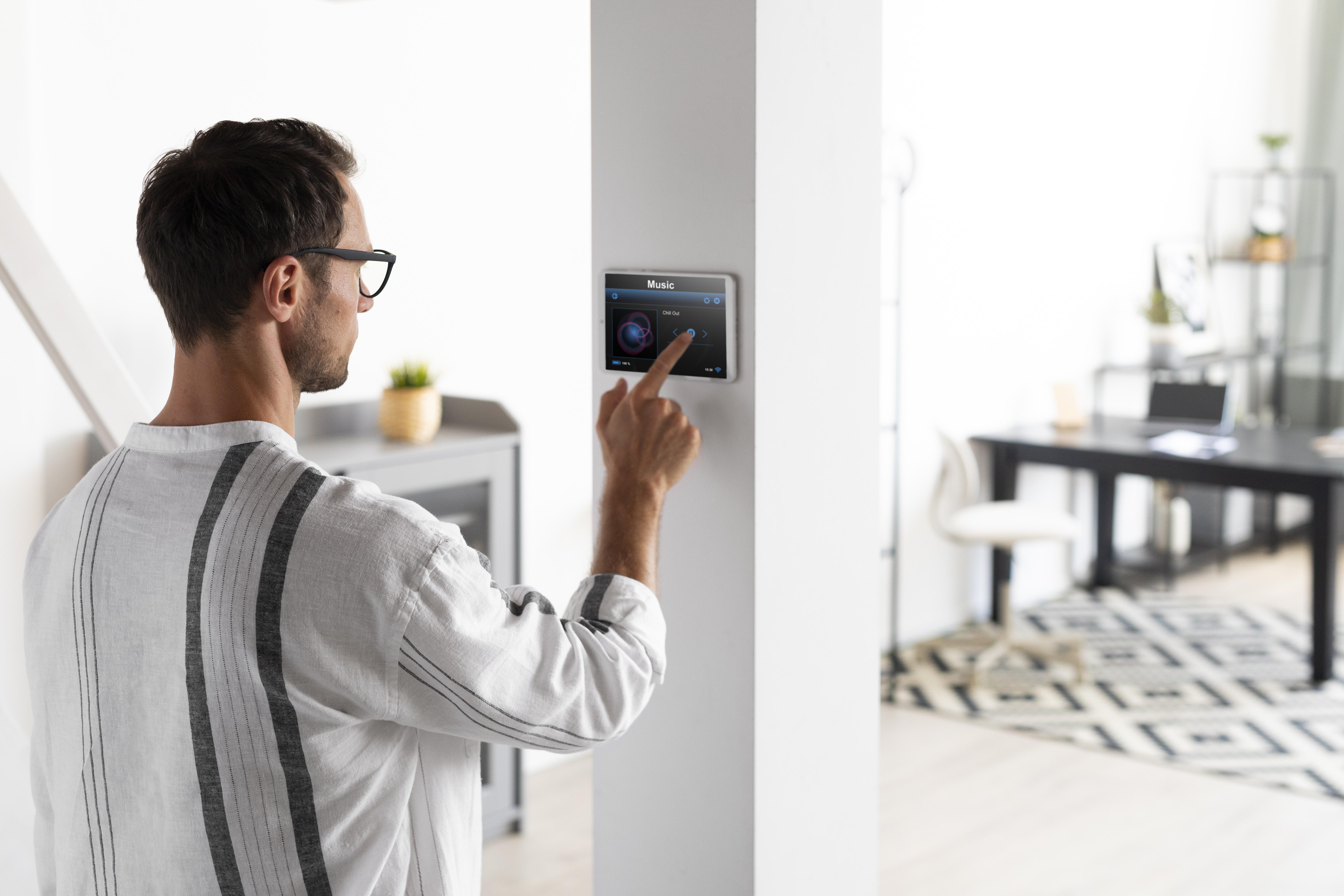man-using-tablet-his-smart-home man-using-tablet-his-smart-home
