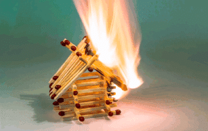 house made of matchsticks on fire